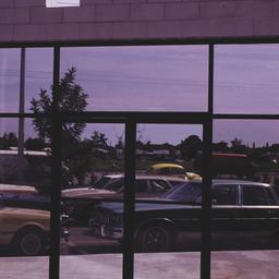 Cars seen through freestand...