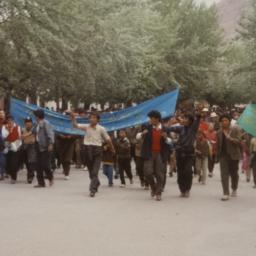 Tibetan demonstrators march...