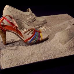Shoe display with sand shoes.