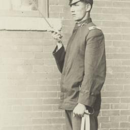 Young Man in Uniform Saluti...