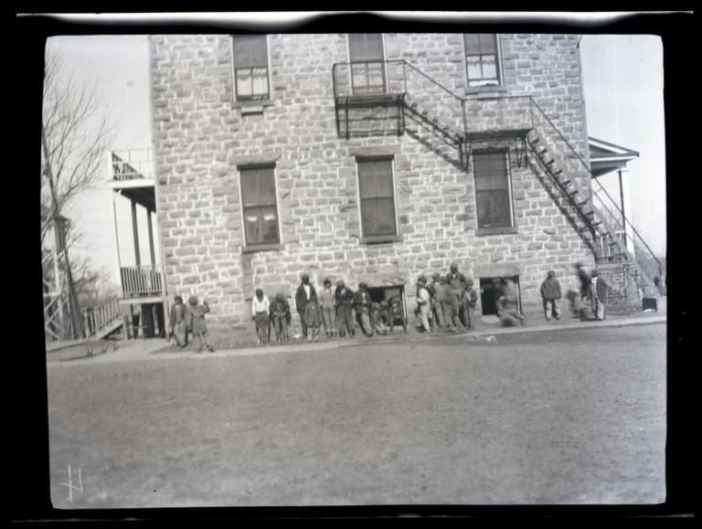 Boys outside of Pawnee School, Oklahoma