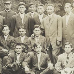 Group of Men Posing between...