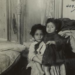 Two Children Beside Bed