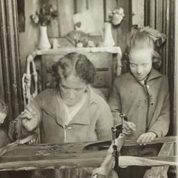 Children with Woman Sewing