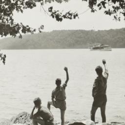 Boys Waving at Boat from Shore