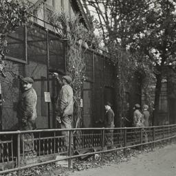 Men Painting Cages
