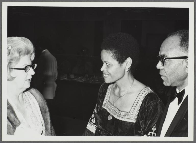 Barbara and Ulysses Kay talking with woman